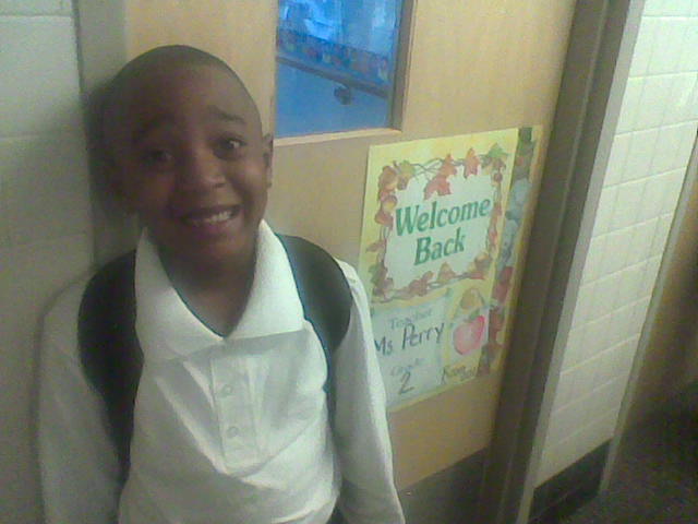 Joshua outside of 2nd grade classroom